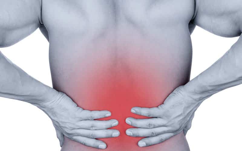 lower back pain man holding back red