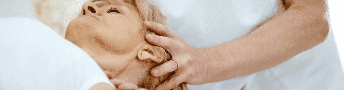 woman getting adjustment head from chiro