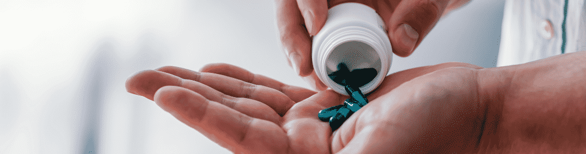 pills being poured into hand