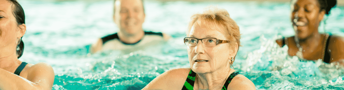 A women excercising in a pool 