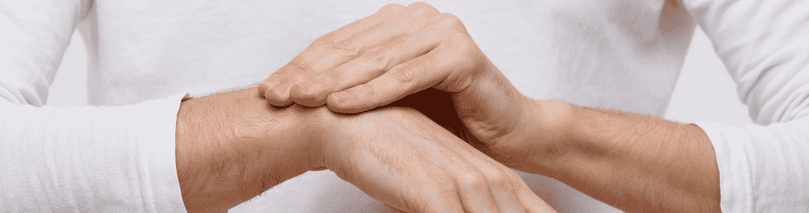 A person rubbing their wrist 