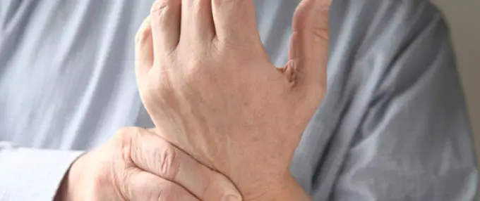 man holding wrist
