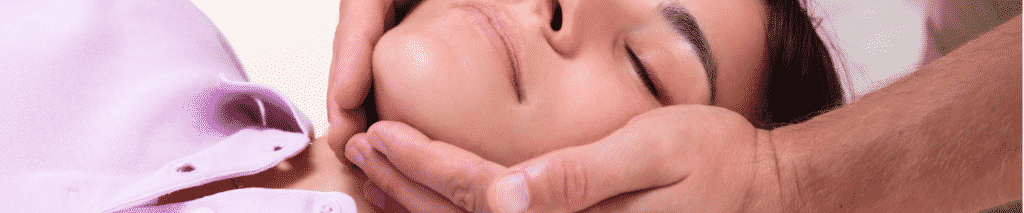 Woman getting her jaw adjusted